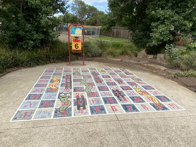 Playgrounds with Snakes and Ladders Games
