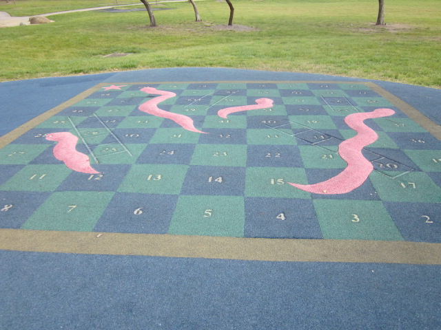 Playgrounds with Snakes and Ladders Games