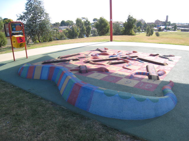 Playgrounds with Snakes and Ladders Games