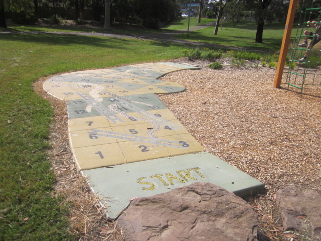 Playgrounds with Snakes and Ladders Games