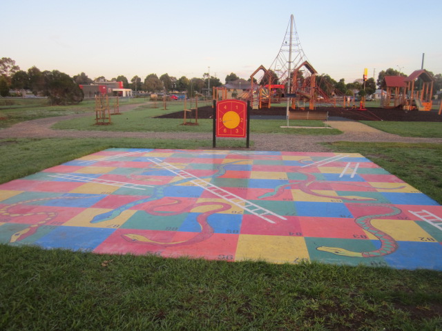 Playgrounds with Snakes and Ladders Games