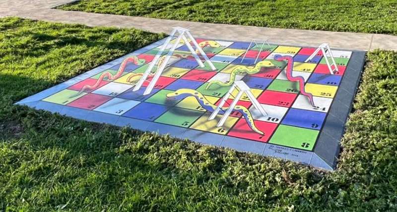 Playgrounds with Snakes and Ladders Games